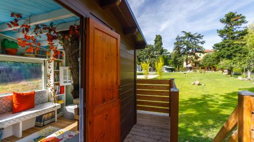 an open door to a house with a yard at La Casa Di Nanì 8, Emma Villas in Forlì