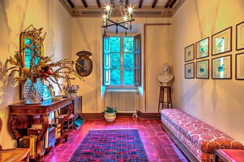 a living room with a couch and a window at La Martinella 12, Emma Villas in Passignano sul Trasimeno