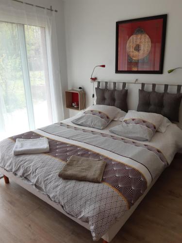 מיטה או מיטות בחדר ב-Le bois bouquet