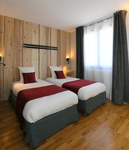 Postel nebo postele na pokoji v ubytování Hôtel Restaurant La Buffe
