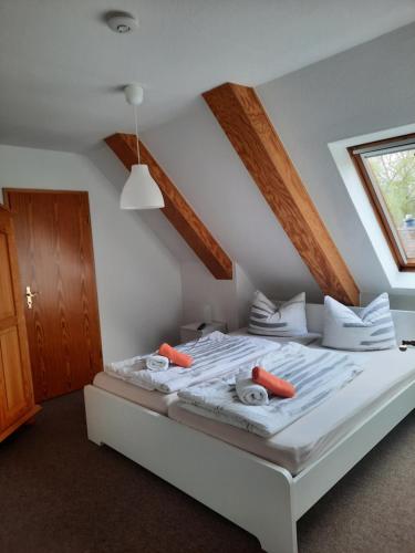 a bedroom with a bed with towels on it at Fährhaus Schwabstedt in Schwabstedt