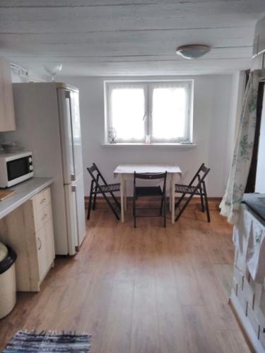 Η κουζίνα ή μικρή κουζίνα στο Rustykalny Apartament