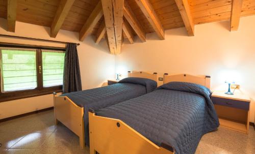 Postel nebo postele na pokoji v ubytování Casa Lori