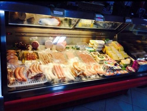 a display case with many different types of food at TipTop Hotel, Resto and Delishop in Panglao
