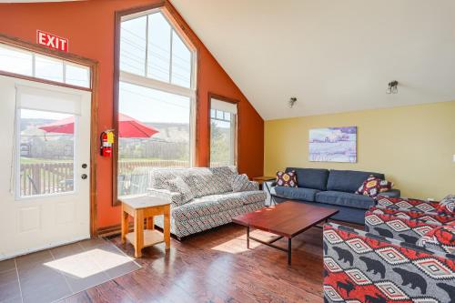 a living room with two couches and a door at Blue View 6 Stella Chalet 84149 in Blue Mountains