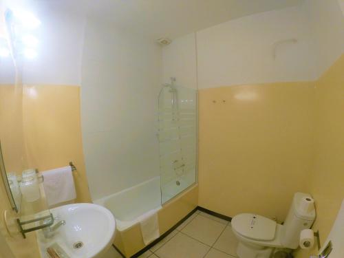 a bathroom with a sink and a toilet and a shower at Hotel Roc de St Miquel & Apartment in Soldeu