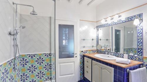 a bathroom with a sink and a shower at Virginia 8, Emma Villas in Gavorrano