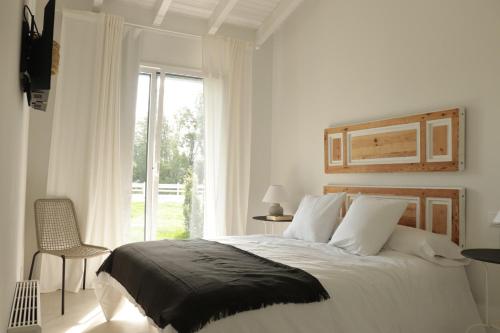 Ένα ή περισσότερα κρεβάτια σε δωμάτιο στο El Pueblín de Ribadesella