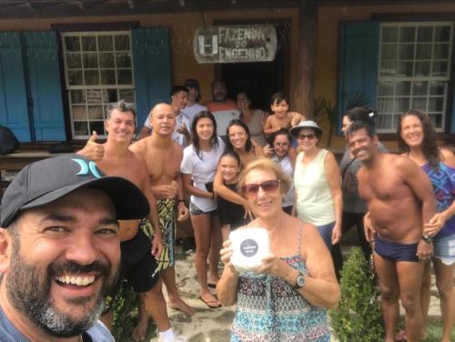 a group of people standing in front of a house at Chalés do Recanto in São João del Rei
