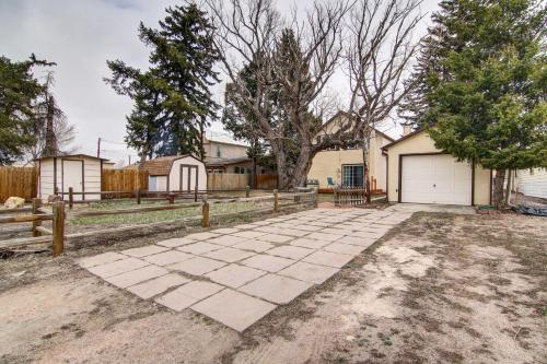 a house with a driveway and a fence at Monument Retreat - Walk to Local Dining and Shopping in Monument