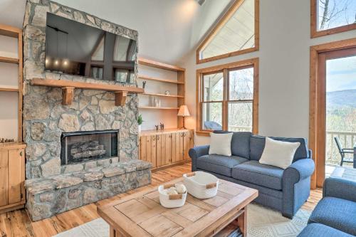 a living room with a couch and a fireplace at Sapphire Retreat with 2 Decks, Views and Resort Access in Sapphire