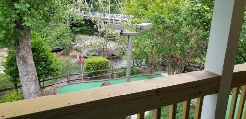a balcony with a view of a swimming pool at Broad River Inn in Chimney Rock