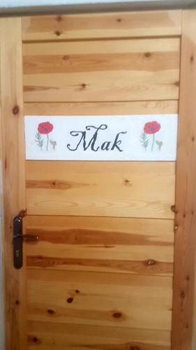 a door with a sign that says alpha on it at Dziewanna in Brzeziniec
