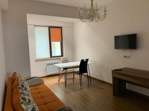a living room with a couch and a table at City Central Apartment in Yerevan