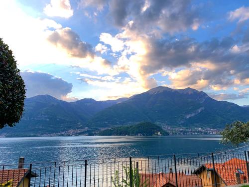a view of a large body of water with mountains at Residence Molinari Lake Como in Lezzeno
