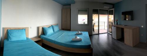 Katil atau katil-katil dalam bilik di Ajkoski Apartments Pestani