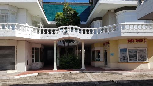 a building with a balcony on top of it at Departamento Zona Dorada Mazatlán 6 in Mazatlán