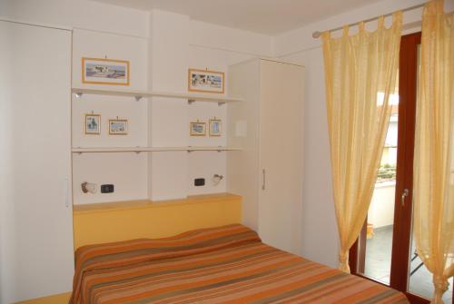 Cama ou camas em um quarto em I Portici Apartments
