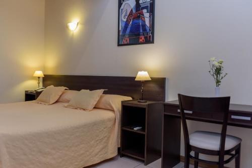 Ένα ή περισσότερα κρεβάτια σε δωμάτιο στο Hotel Cerro Blanco