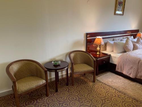 Postel nebo postele na pokoji v ubytování Boulevard Palace Hotel