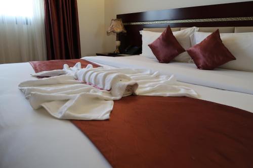 Postel nebo postele na pokoji v ubytování Boulevard Palace Hotel