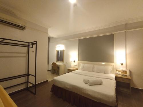 Ένα ή περισσότερα κρεβάτια σε δωμάτιο στο Hotel Deleeton