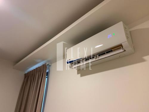 a wall mounted air conditioner in a ceiling at Spacious Big Room, Designed & Quiet Family Home, Eclipse in Cyberjaya by Flexihome-MY in Cyberjaya