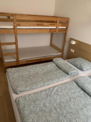 two bunk beds in a small room at Happy Boglár Apartman in Balatonboglár