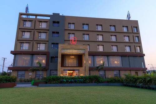 a building with the number six on it at Lords Eco Inn Jamnagar - Apple Gate in Jamnagar