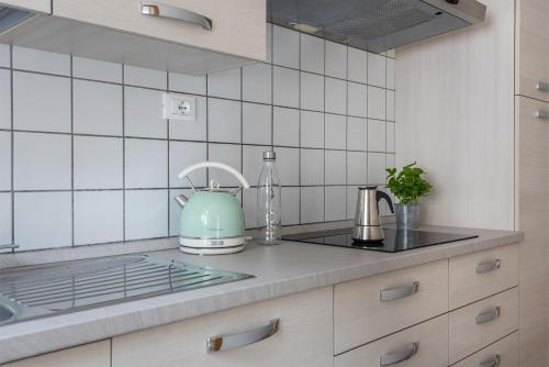 a kitchen with a teapot sitting on a counter at Residenza Ester in Riva del Garda
