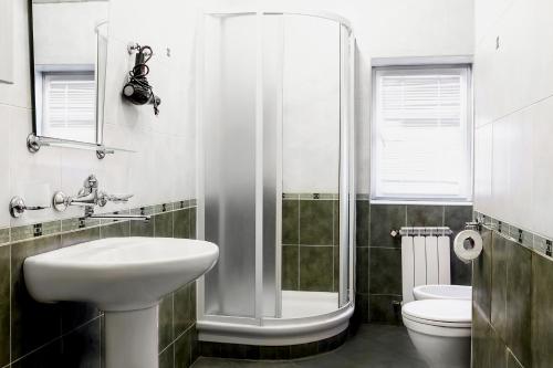 a bathroom with a shower and a sink and a toilet at 2 Bedroom Apartment on Chaikovski street in Yerevan