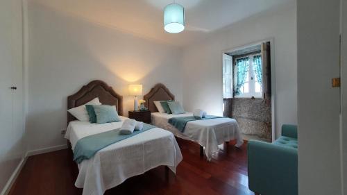 En eller flere senge i et værelse på Casa em Ponte de Lima