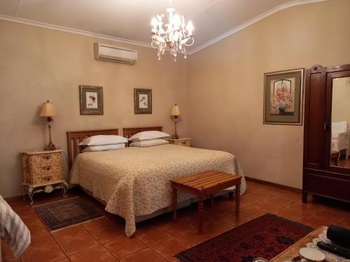Postel nebo postele na pokoji v ubytování Avondrust Guest House