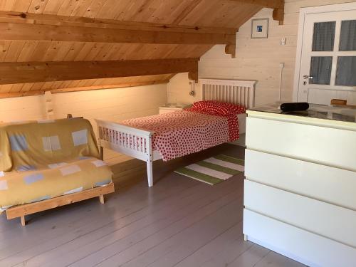 a room with two beds in a wooden house at THE CABIN, KYPARISSIA in Kyparissia
