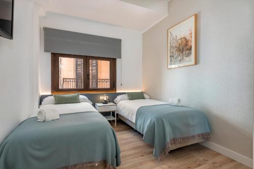 Säng eller sängar i ett rum på Can Rubi - Turismo de Interior