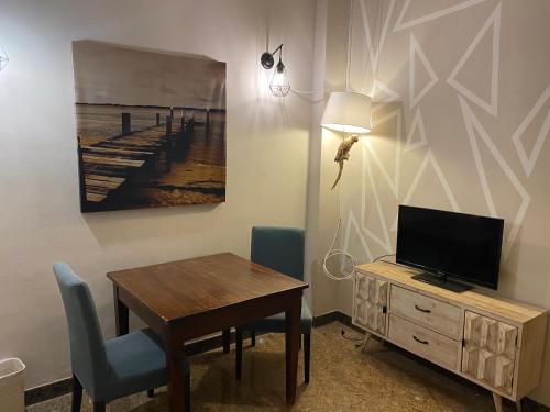 TV a/nebo společenská místnost v ubytování Rigoletto Rental Rooms