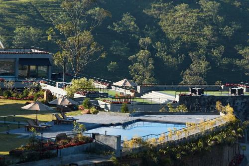 a resort with a swimming pool and a mountain at The Argyle Luxury Boutique in Hatton