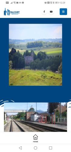 a screenshot of a webpage with a picture of a field at Maison d'hôtes Les Notes Endormies in Walcourt