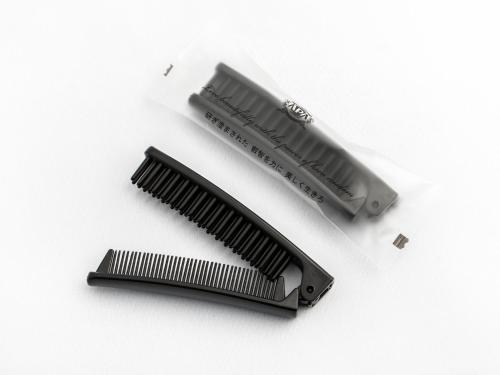 a comb and a toothbrush on a white background at APA Hotel Sugamo Ekimae in Tokyo
