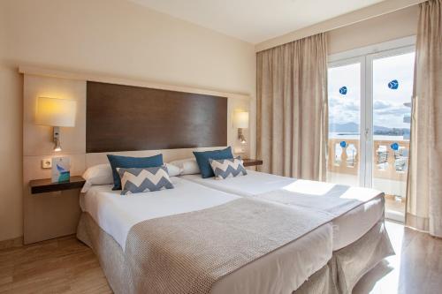 Postel nebo postele na pokoji v ubytování Grupotel Dunamar