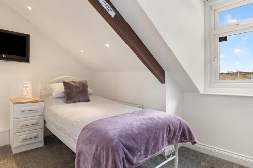 Ένα ή περισσότερα κρεβάτια σε δωμάτιο στο Coach Guest House