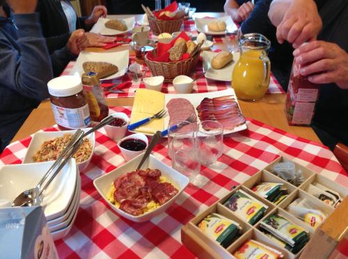 a table with a red and white checkered table cloth at Alevi Camping in Stöllet