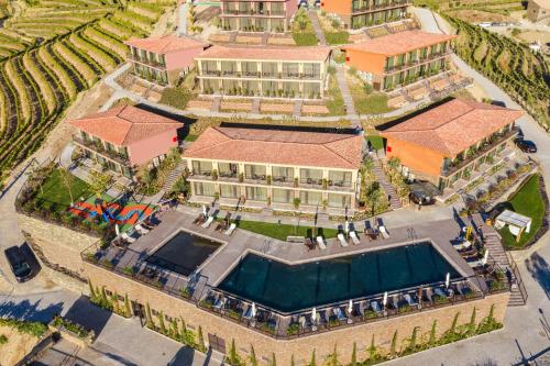 an aerial view of a building with a swimming pool at Vila Gale Douro Vineyards in Armamar