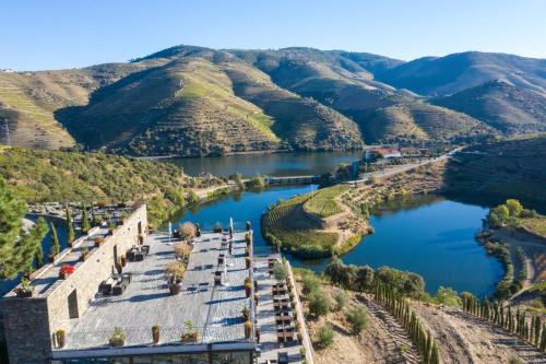 an aerial view of a river with mountains in the background at Vila Gale Douro Vineyards in Armamar