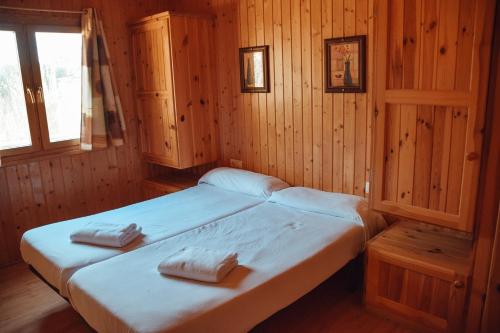 Postel nebo postele na pokoji v ubytování Camping La Aldea