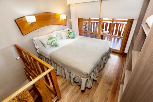 Ένα ή περισσότερα κρεβάτια σε δωμάτιο στο Tupa Hotel Iguazu
