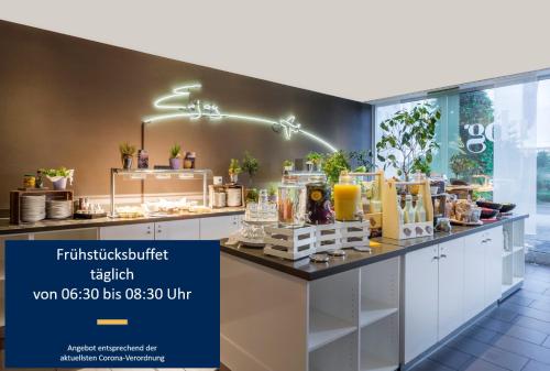 a shop with a counter filled with lots of products at Park Inn by Radisson Frankfurt Airport in Frankfurt/Main