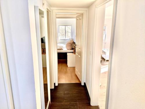 a hallway with a hallway leading to a room at fewo1846 - Hyggelig Ferie - komfortable ländlich gelegene 2-Zimmer-Wohnung in Flensburg