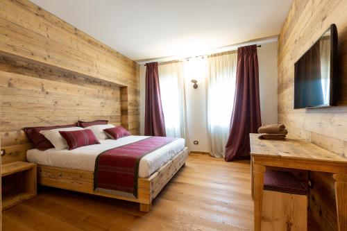 Телевизор и/или развлекательный центр в Relais Althea Azienda Agrituristica