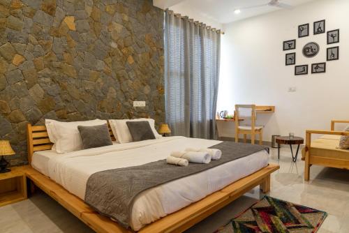 Ένα ή περισσότερα κρεβάτια σε δωμάτιο στο ilaka Homes